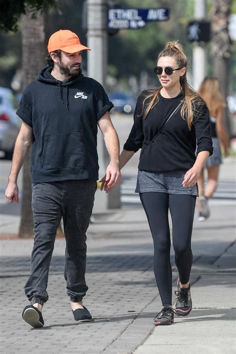 Elizabeth Olsen packs on the PDA with her husband Robbie Arnett